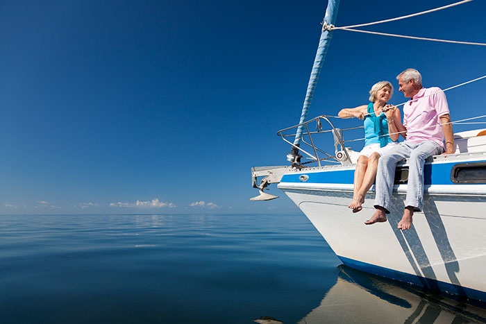 Elderly couple seating on boat